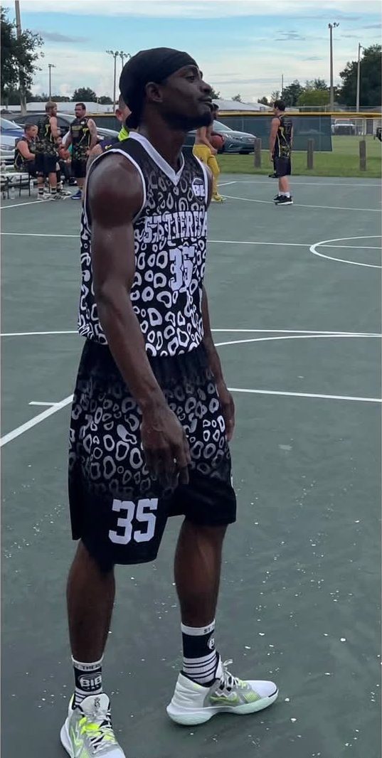 St. Theresa player number 35 setting up on the court