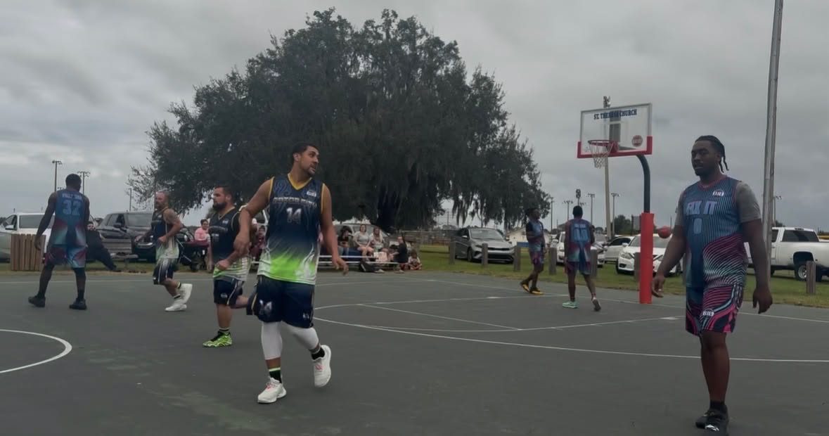 Full court game day at the St. Theresa courts with families watching