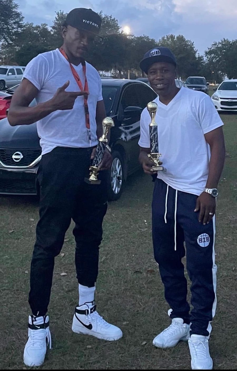 B.I.B and the founder of MYND-RITE holding league trophies